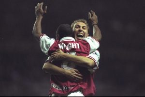 Ian Wright of Arsenal celebrates his winning goal with teammate David Platt